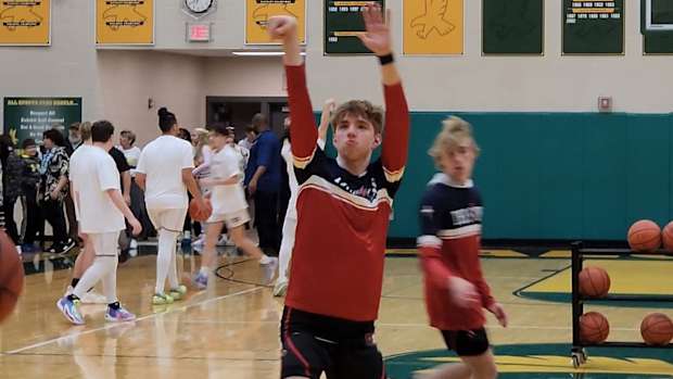Cornerstone Christian Academy junior Quinn "Turtle" Kwasniak warms up before their district semifinal game against Fairport Harbor at Firestone High School in Akron on March 5, 2024.